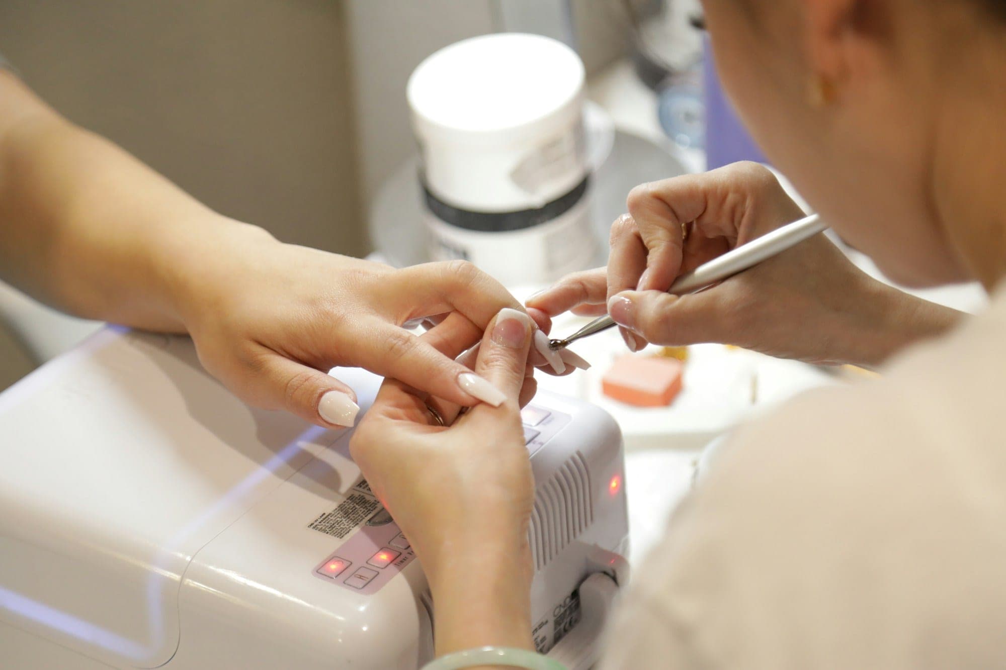 Manicure appointment with a neutral polish