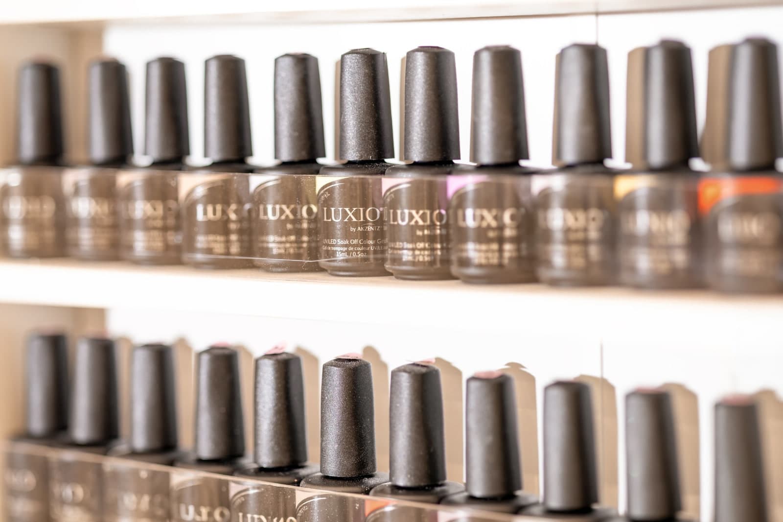 Rows of Luxio gel polish bottles at CHIC